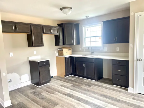 a kitchen with a sink and a stove