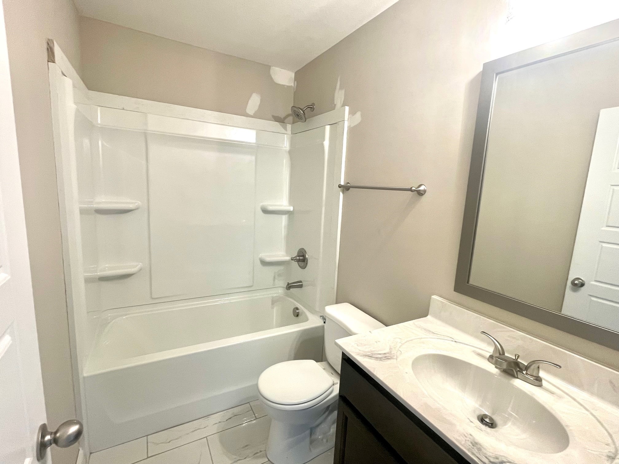 13 Echo Ridge Oak Grove, KY 42262 - Photo 10 of 24 a bathroom with a sink toilet and shower