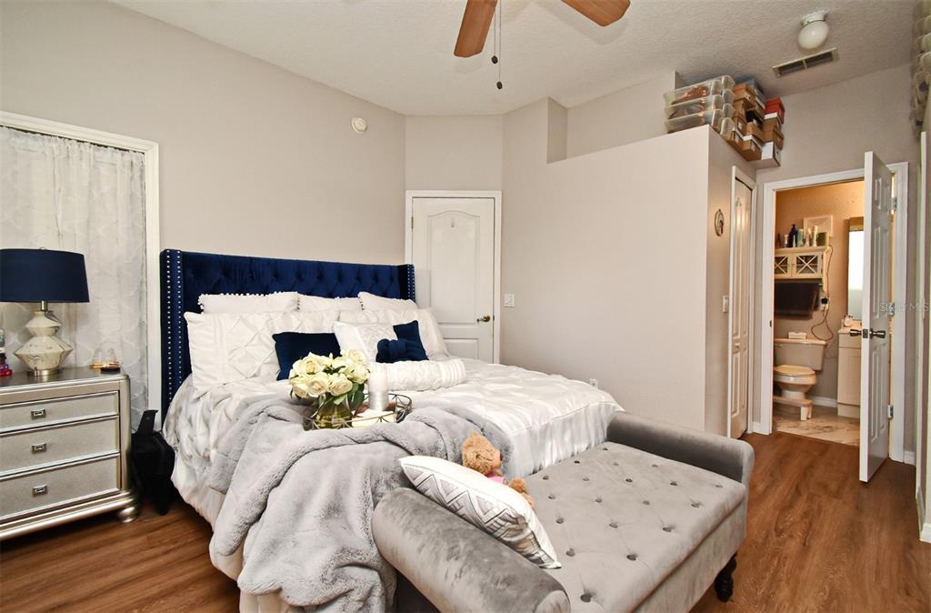 700 Seabrook Court, Unit 102 Altamonte Springs, FL 32714 - Photo 11 of 22 a bedroom with a bed and wooden floor