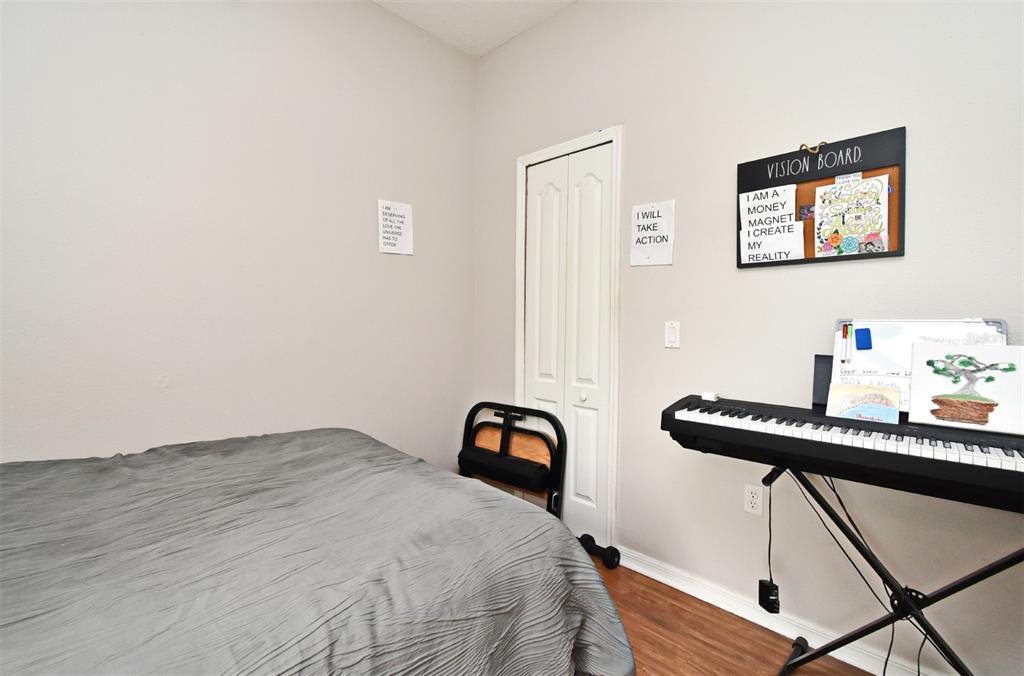 700 Seabrook Court, Unit 102 Altamonte Springs, FL 32714 - Photo 15 of 22 a bedroom with a bed and a desk