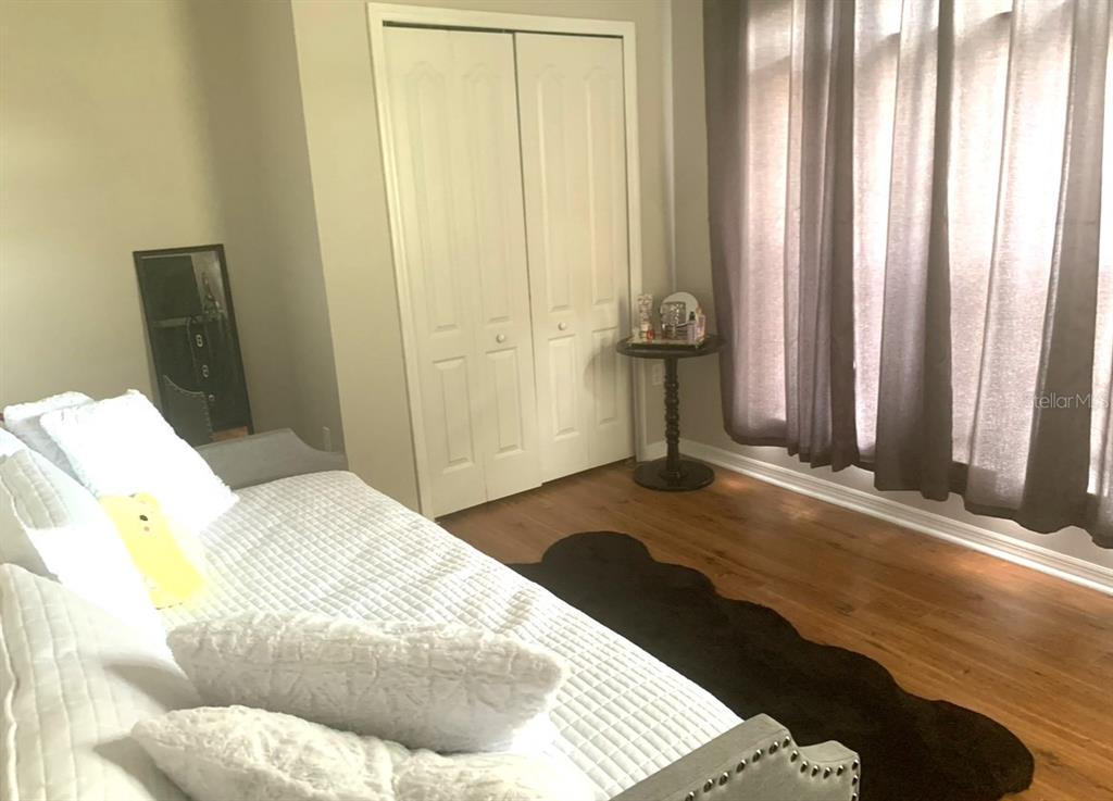 700 Seabrook Court, Unit 102 Altamonte Springs, FL 32714 - Photo 17 of 22 a bedroom with a bed and a window