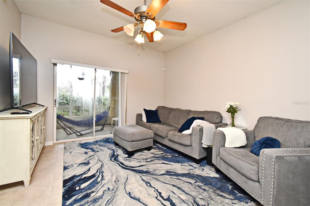 700 Seabrook Court, Unit 102 Altamonte Springs, FL 32714 - Photo 3 of 22 a living room with furniture and a flat screen tv