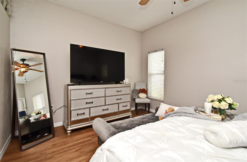 700 Seabrook Court, Unit 102 Altamonte Springs, FL 32714 - Photo 10 of 22 a bedroom with a bed and flat screen tv
