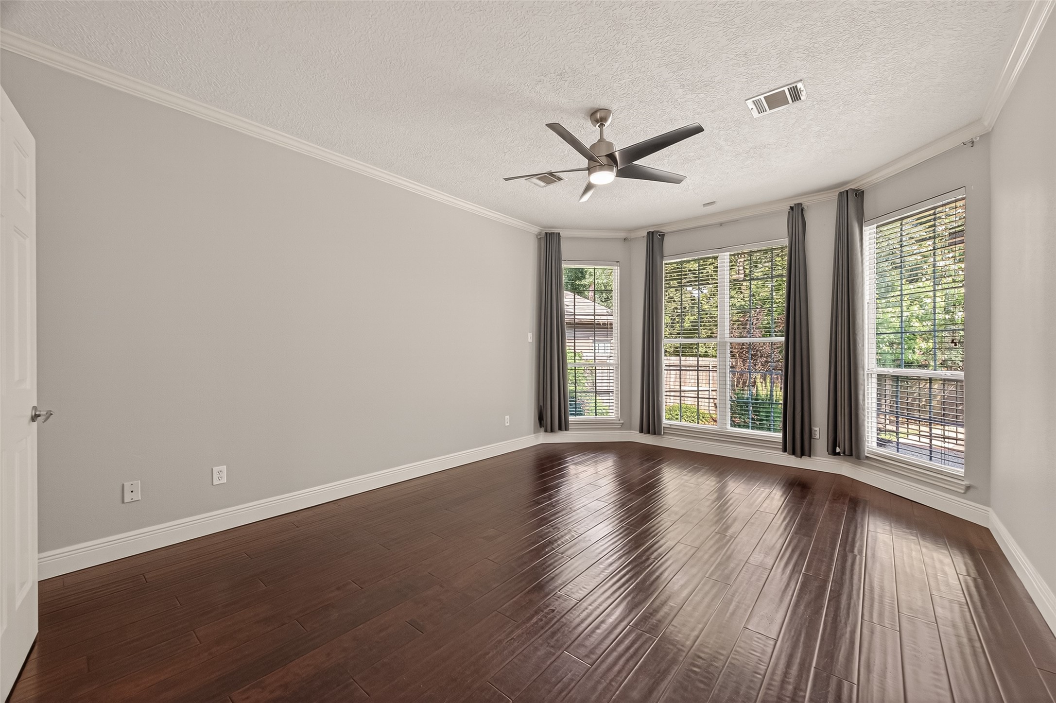 6131 Hampton Way Court Spring, TX 77389 - Photo 35 of 50 a view of an empty room with wooden floor and a window