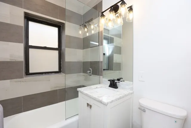 a bathroom with a sink a toilet and a bathtub