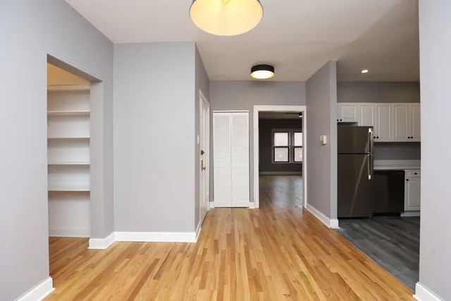a view of hallway with wooden floor