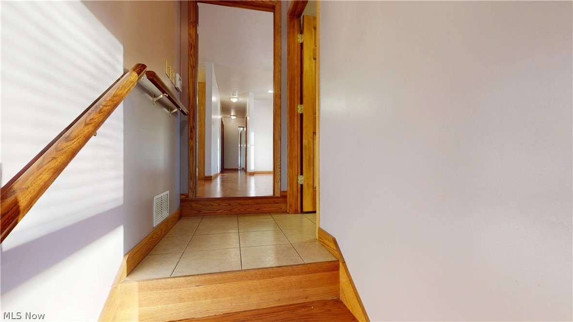 1284 River Road Morgantown, WV 26501 - Photo 16 of 50 JUST A FEW STAIRS UP FROM REC ROOM TO A FULL BATHROOM GOING INTO MAIN PART OF HOME
