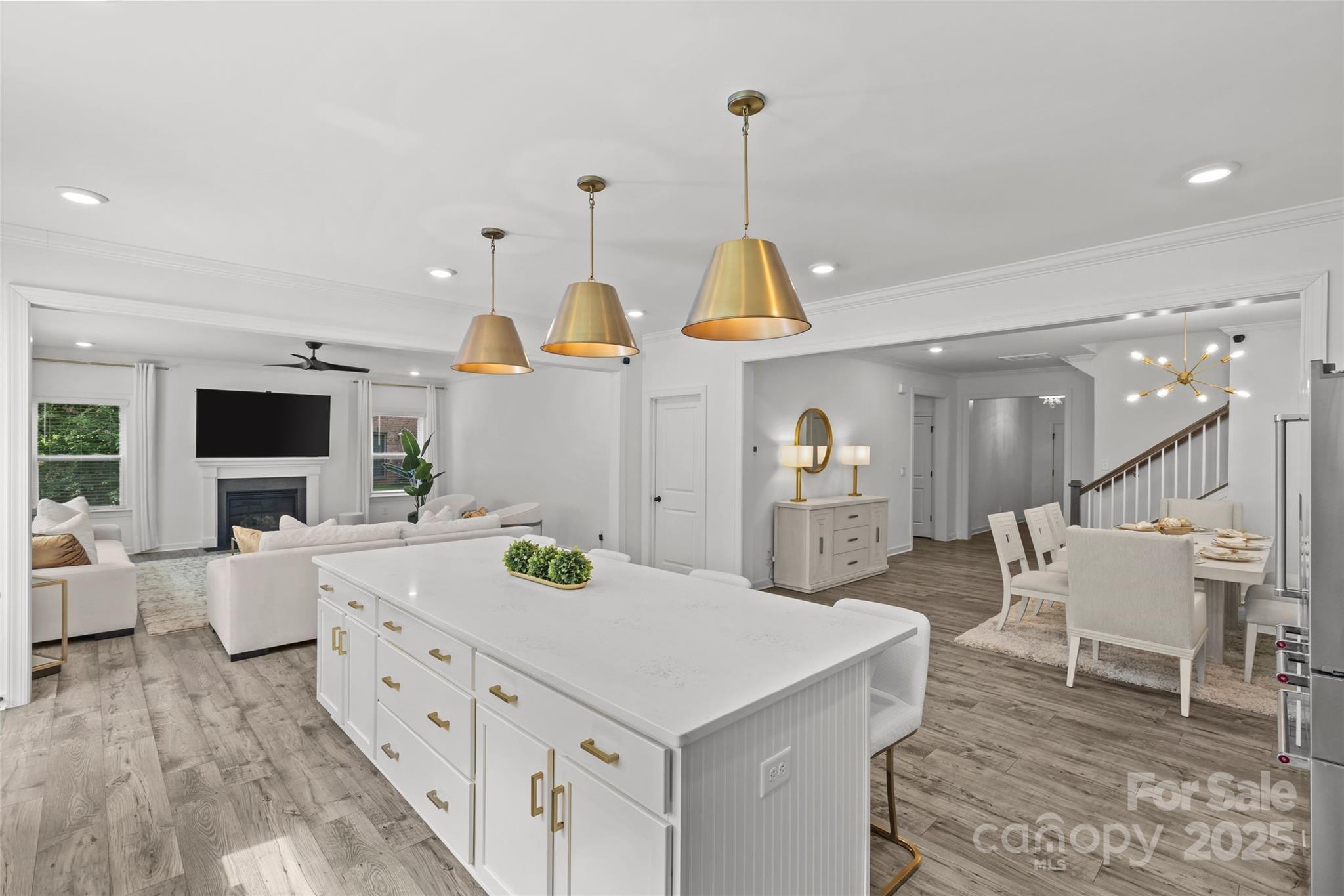 5902 Beatties Ford Road Charlotte, NC 28216 - Photo 13 of 48 a kitchen with stainless steel appliances kitchen island granite countertop a sink and a wooden floors