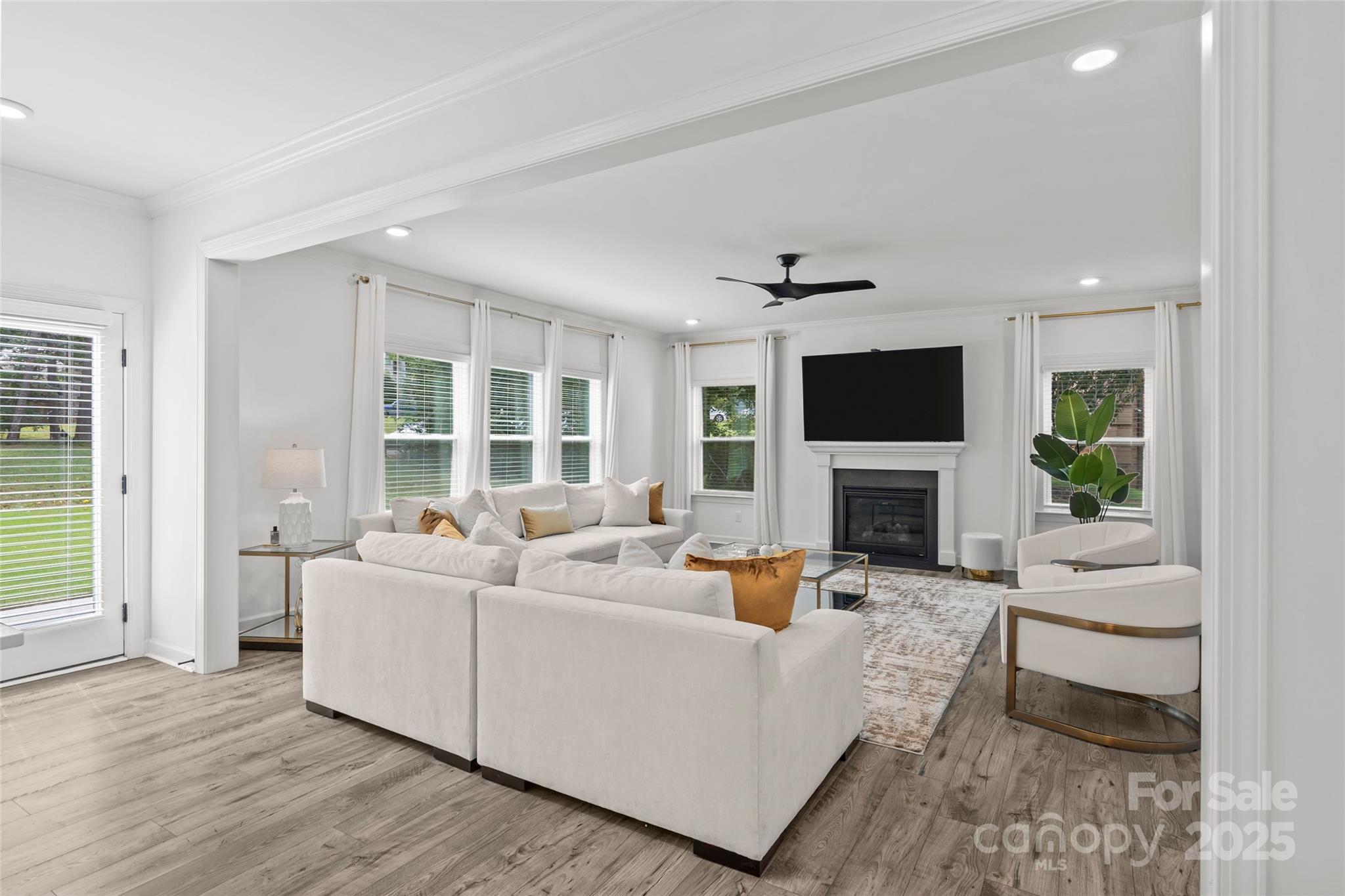 5902 Beatties Ford Road Charlotte, NC 28216 - Photo 17 of 48 a living room with furniture and a fireplace