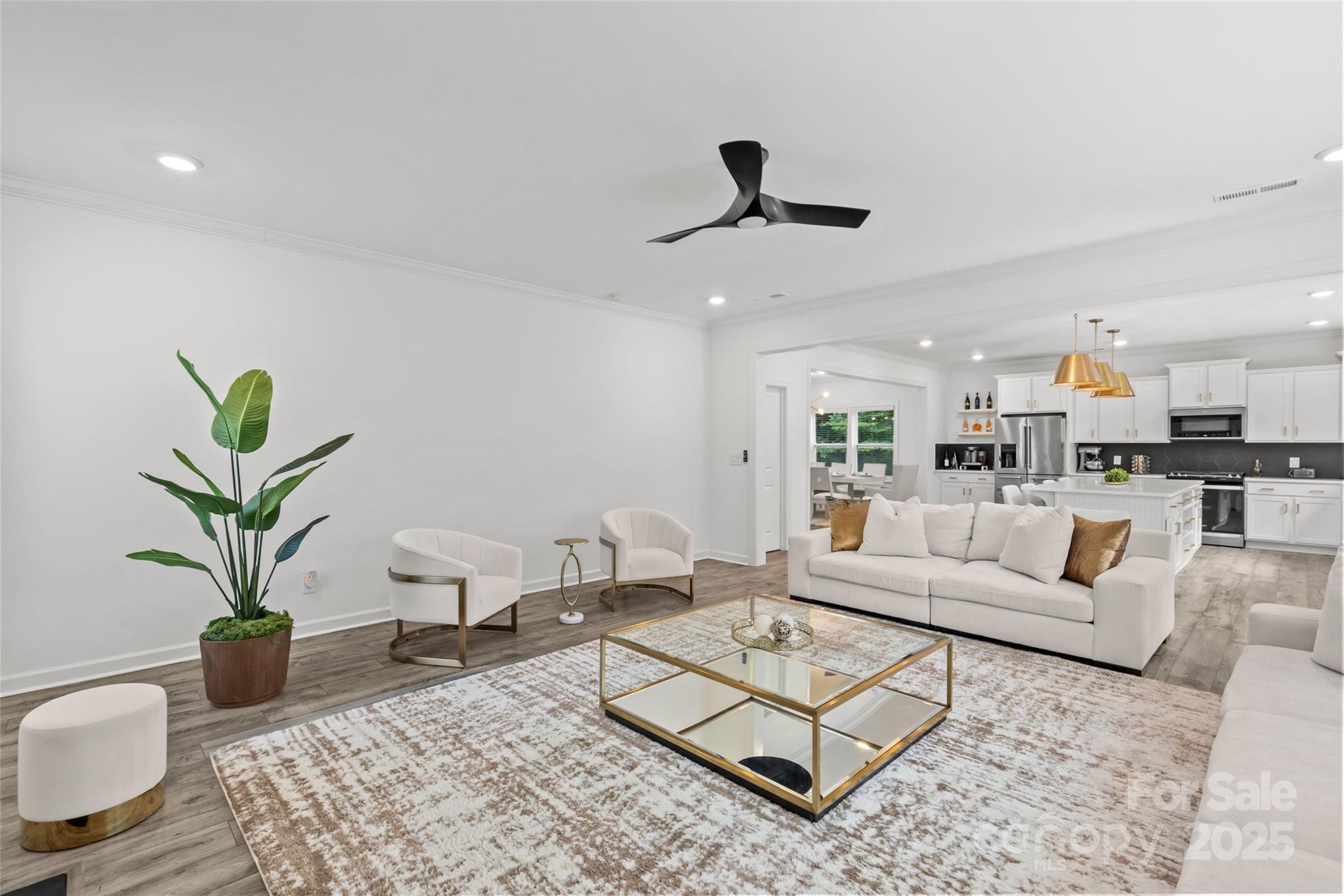 5902 Beatties Ford Road Charlotte, NC 28216 - Photo 21 of 48 a living room with furniture and a potted plant