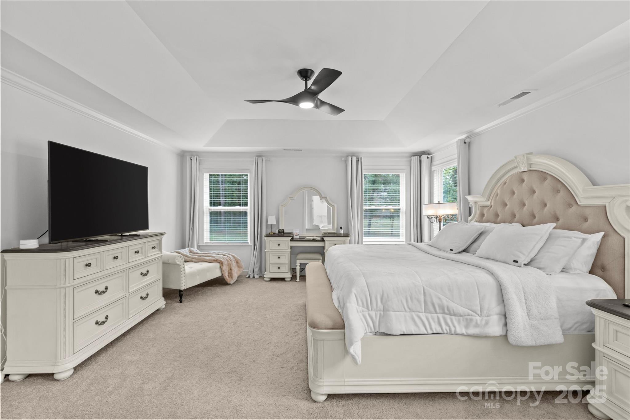 5902 Beatties Ford Road Charlotte, NC 28216 - Photo 25 of 48 a bedroom with furniture and flat screen tv