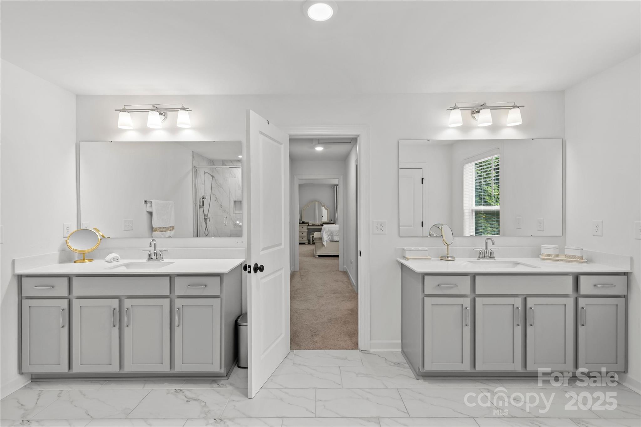 5902 Beatties Ford Road Charlotte, NC 28216 - Photo 30 of 48 a spacious bathroom with a granite countertop sink a toilet and a mirror