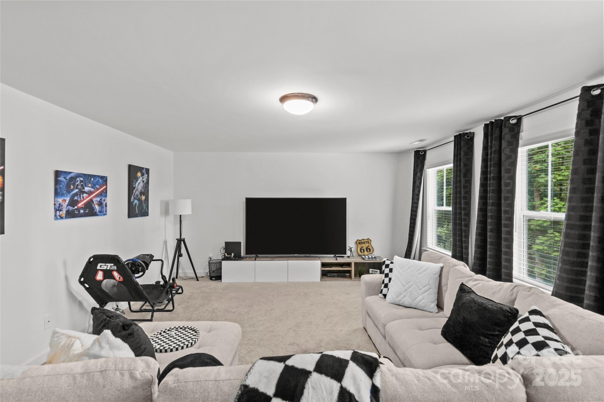 5902 Beatties Ford Road Charlotte, NC 28216 - Photo 33 of 48 a living room with furniture and a flat screen tv