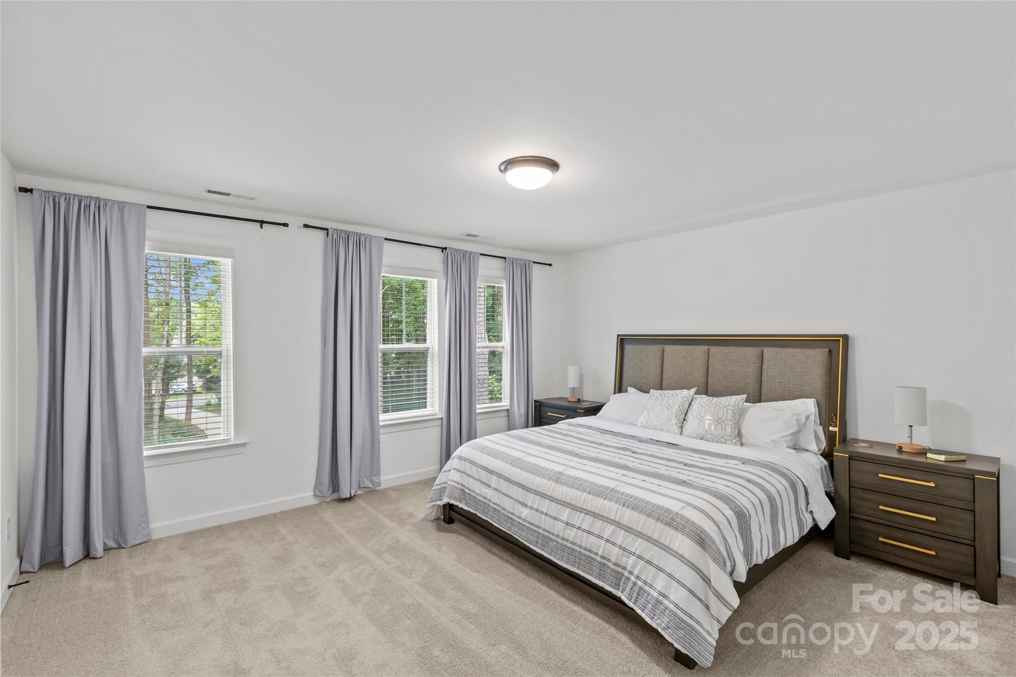 5902 Beatties Ford Road Charlotte, NC 28216 - Photo 35 of 48 a bedroom with a bed and a window