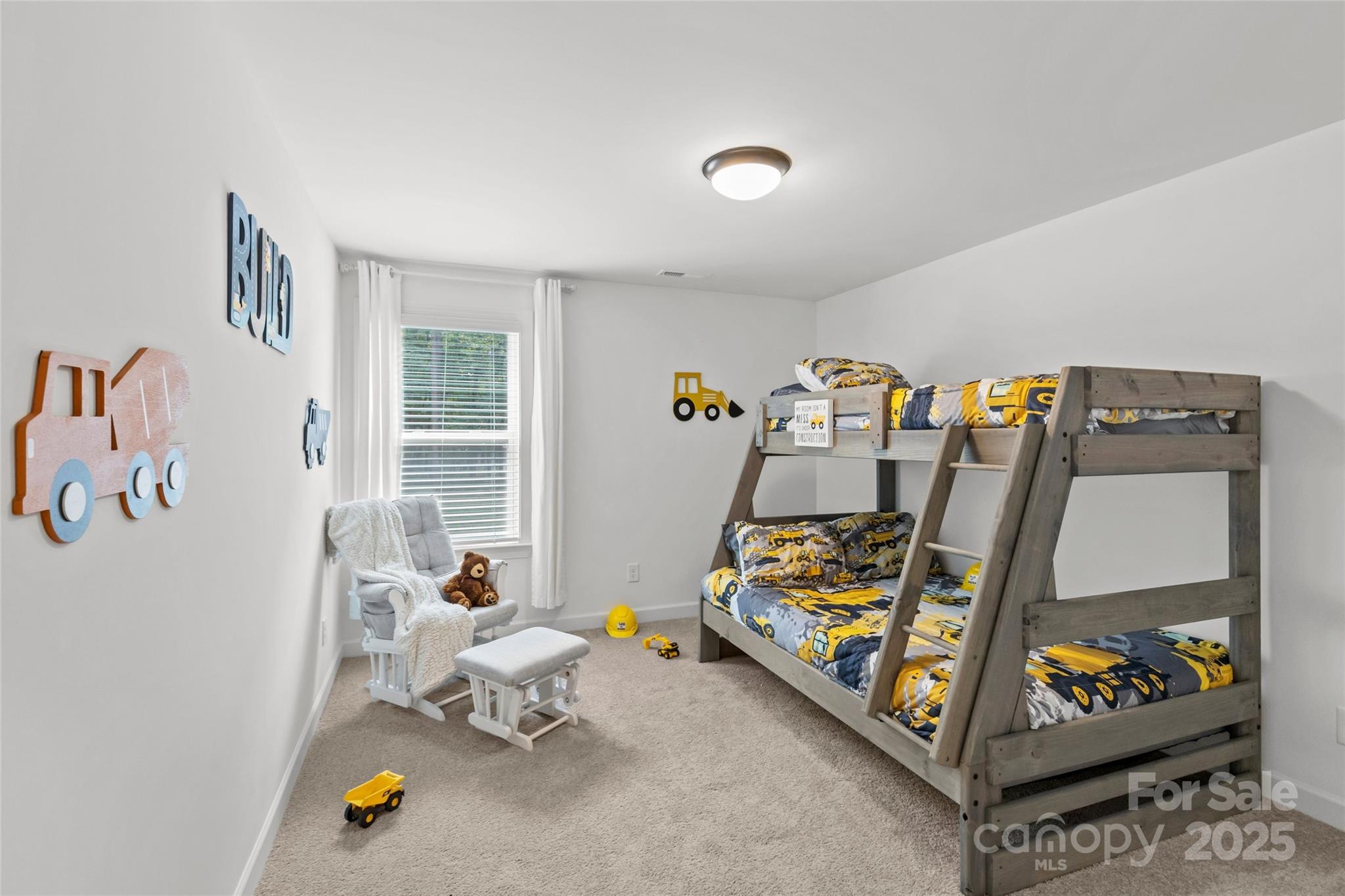 5902 Beatties Ford Road Charlotte, NC 28216 - Photo 36 of 48 a bedroom with a bed and wooden floor