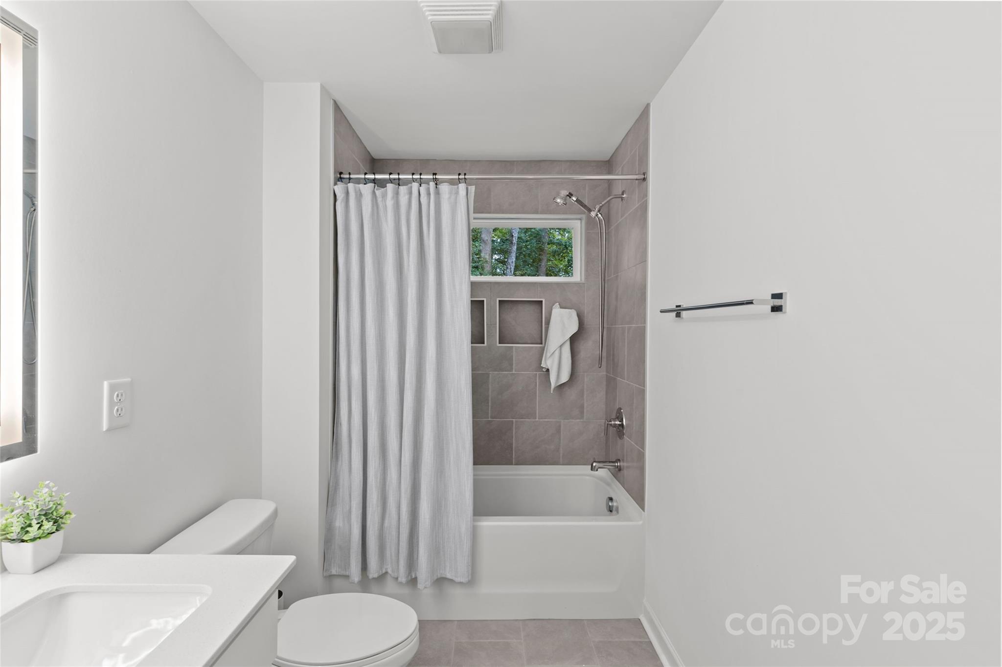 5902 Beatties Ford Road Charlotte, NC 28216 - Photo 38 of 48 a bathroom with a sink toilet and shower