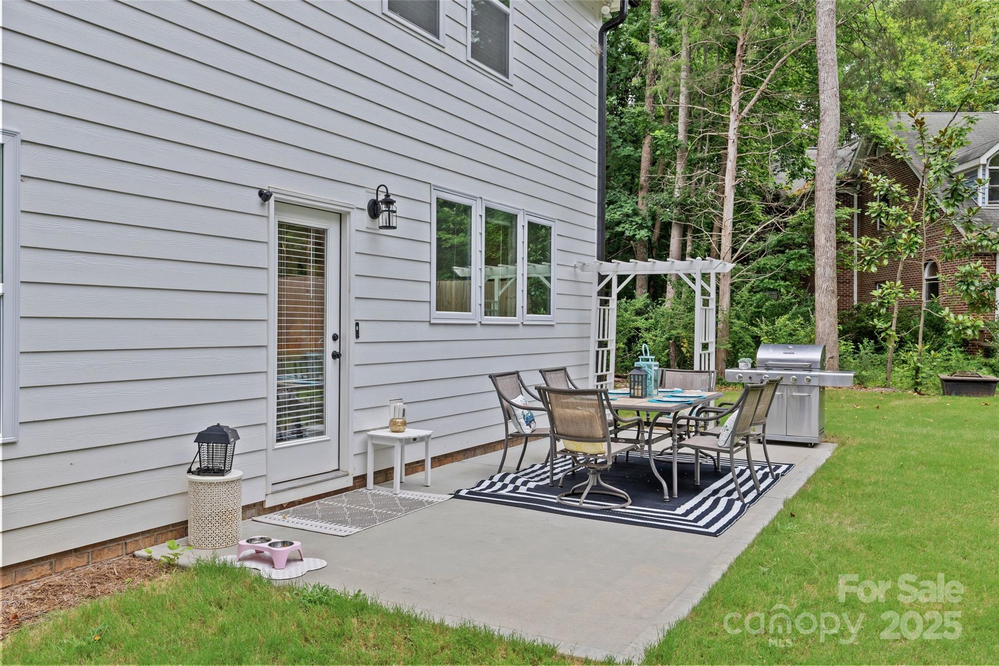 5902 Beatties Ford Road Charlotte, NC 28216 - Photo 44 of 48 a view of a house with backyard and sitting area