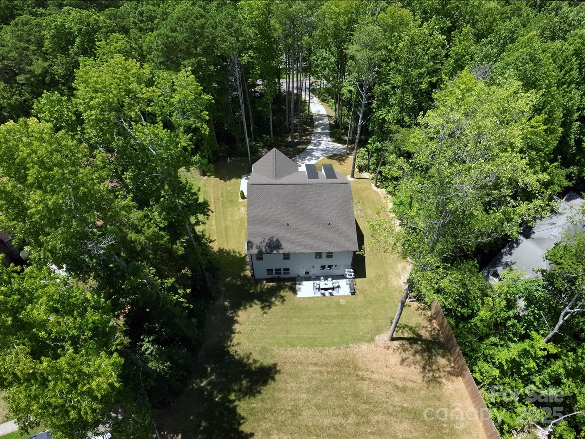 5902 Beatties Ford Road Charlotte, NC 28216 - Photo 46 of 48 a view of a house with a yard