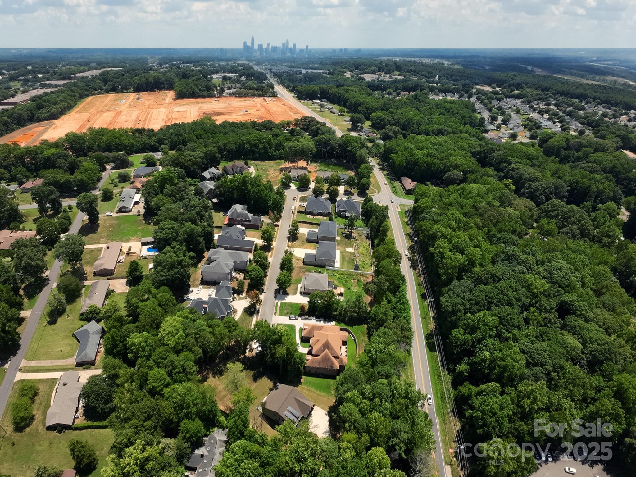 5902 Beatties Ford Road Charlotte, NC 28216 - Photo 48 of 48 an aerial view of residential houses with outdoor space and swimming pool
