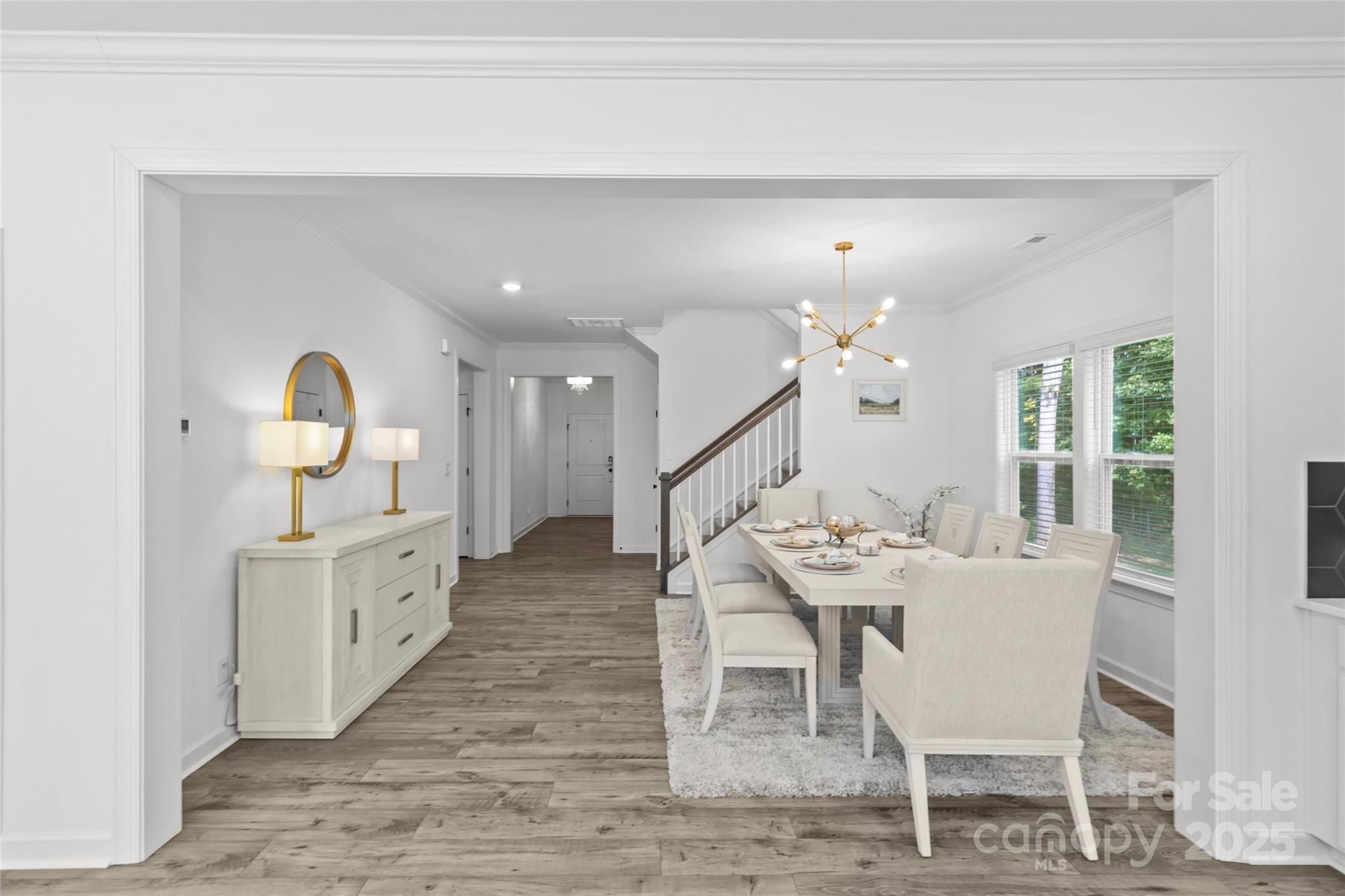 5902 Beatties Ford Road Charlotte, NC 28216 - Photo 8 of 48 a dining room with furniture entryway and wooden floor