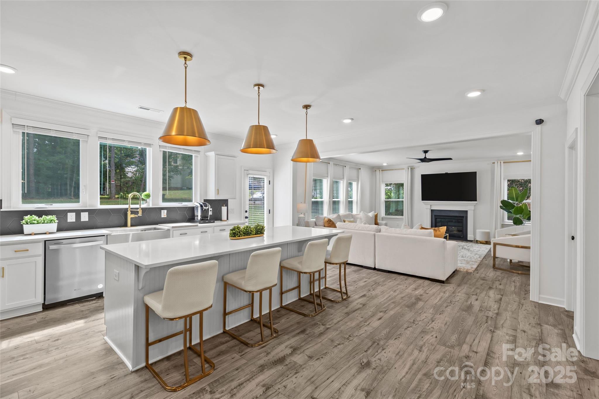 5902 Beatties Ford Road Charlotte, NC 28216 - Photo 10 of 48 a open kitchen with stainless steel appliances granite countertop a sink and dining table with wooden floor