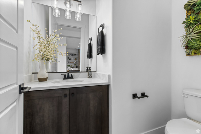 3022 West Sesia Way St. George, UT 84770 - Photo 21 of 52 Half bath featuring vanity and toilet