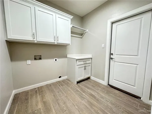 a view of cabinets and wooden floor