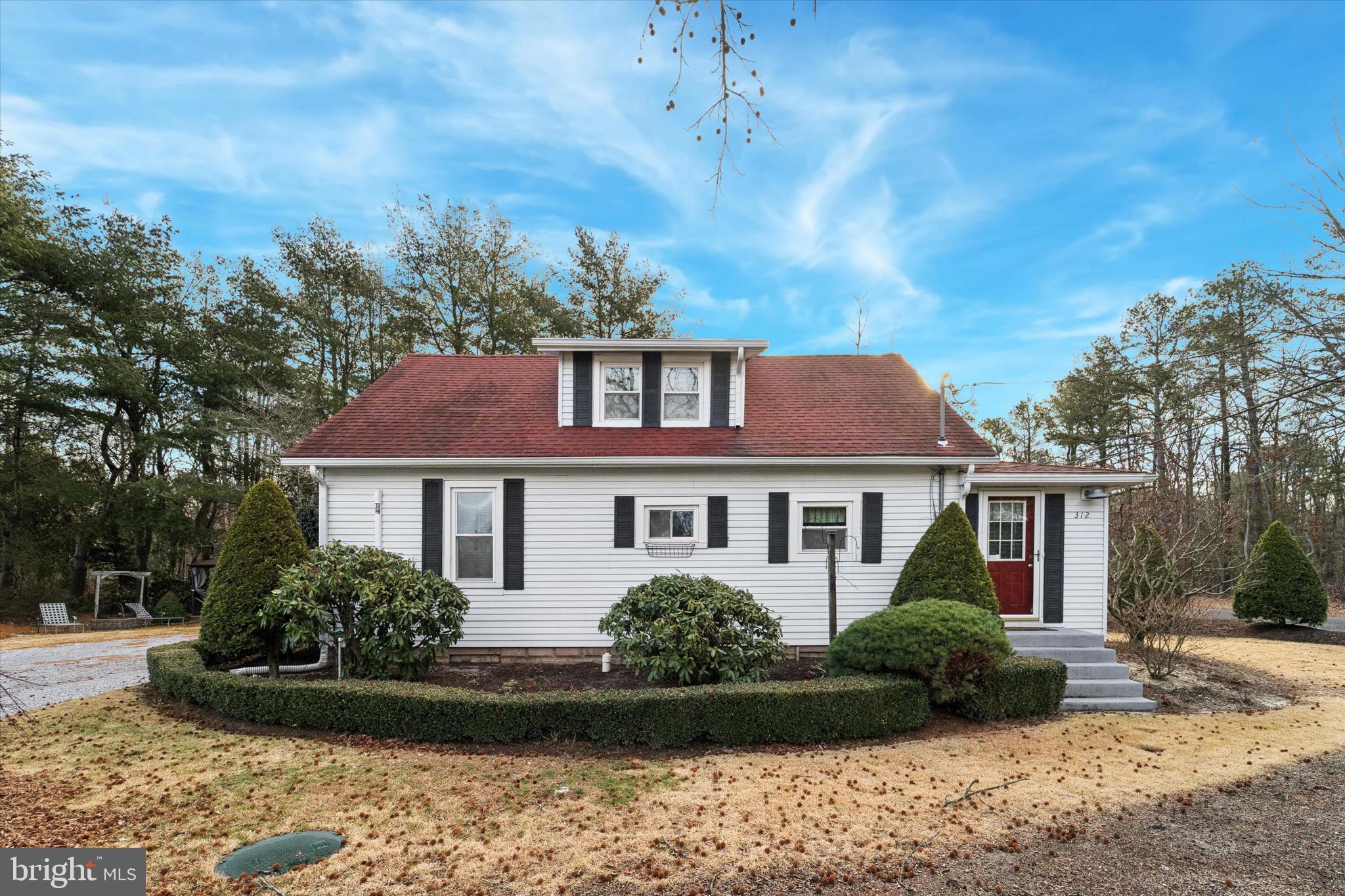 312 Lakedale Road Berlin, NJ 08009 - Photo 46 of 48 a front view of a house with a garden