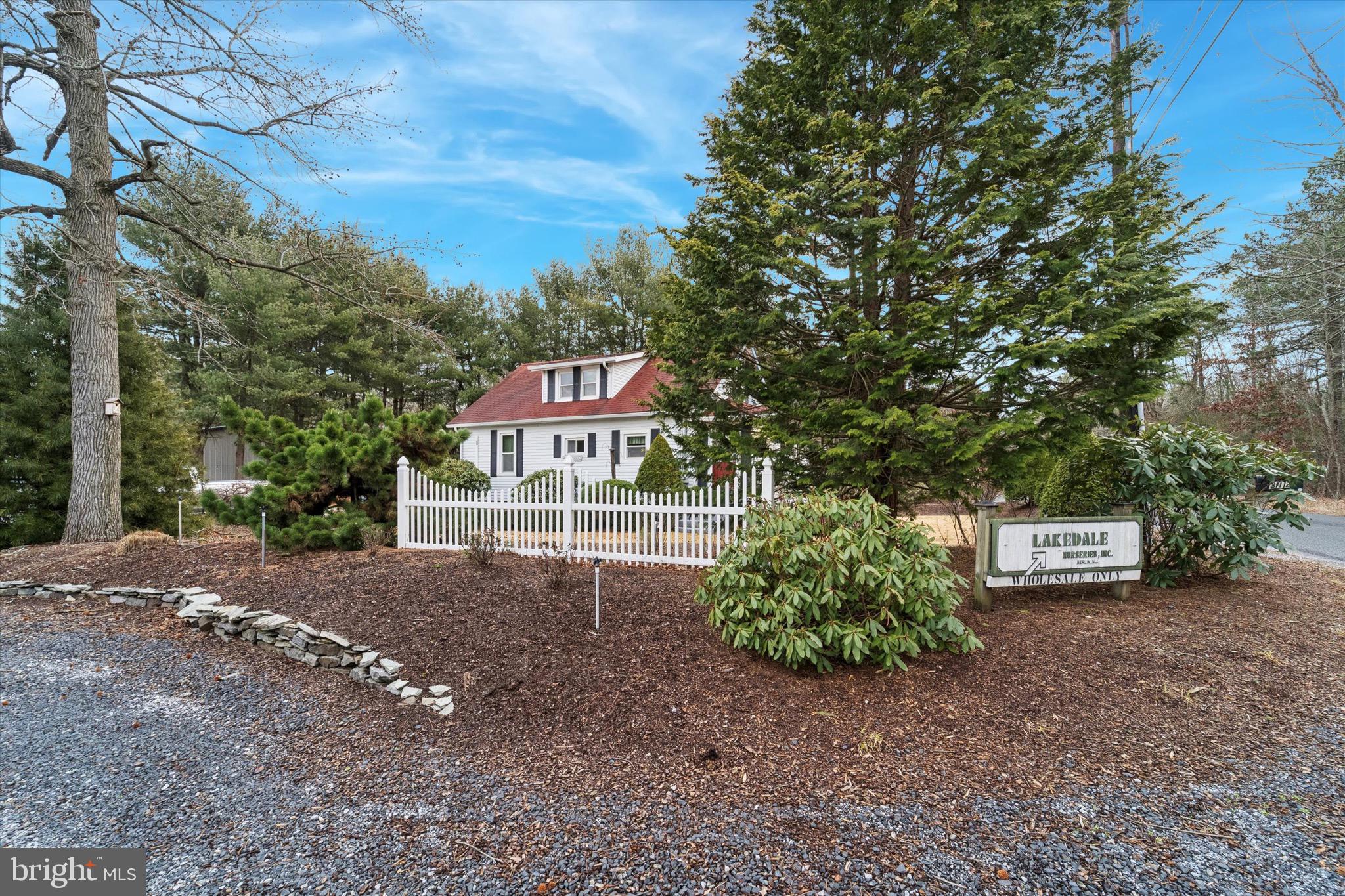 312 Lakedale Road Berlin, NJ 08009 - Photo 47 of 48 a sign board with a house in the background