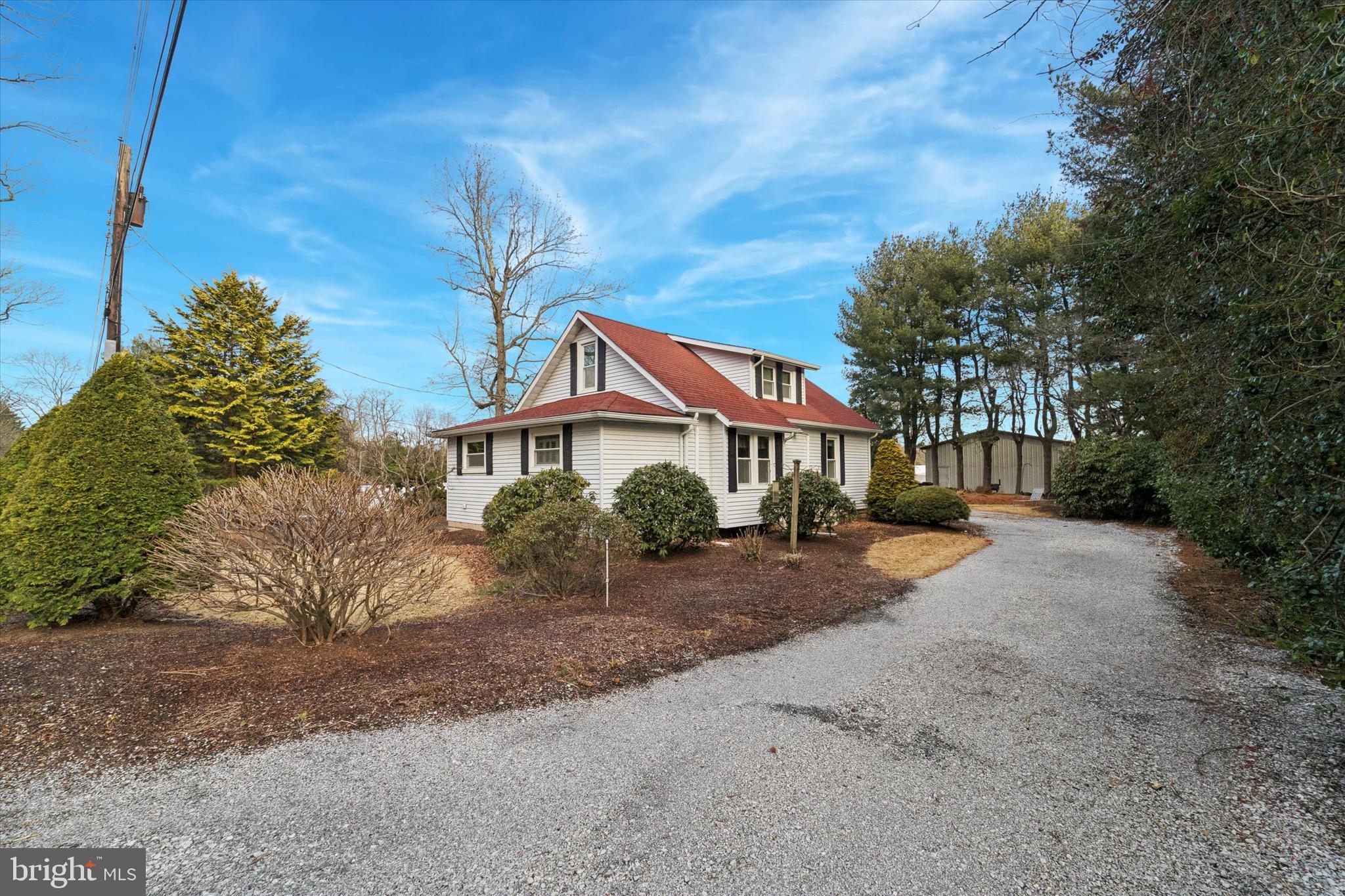 312 Lakedale Road Berlin, NJ 08009 - Photo 48 of 48 a front view of a house with a yard and garage