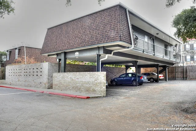 a view of street with parked cars