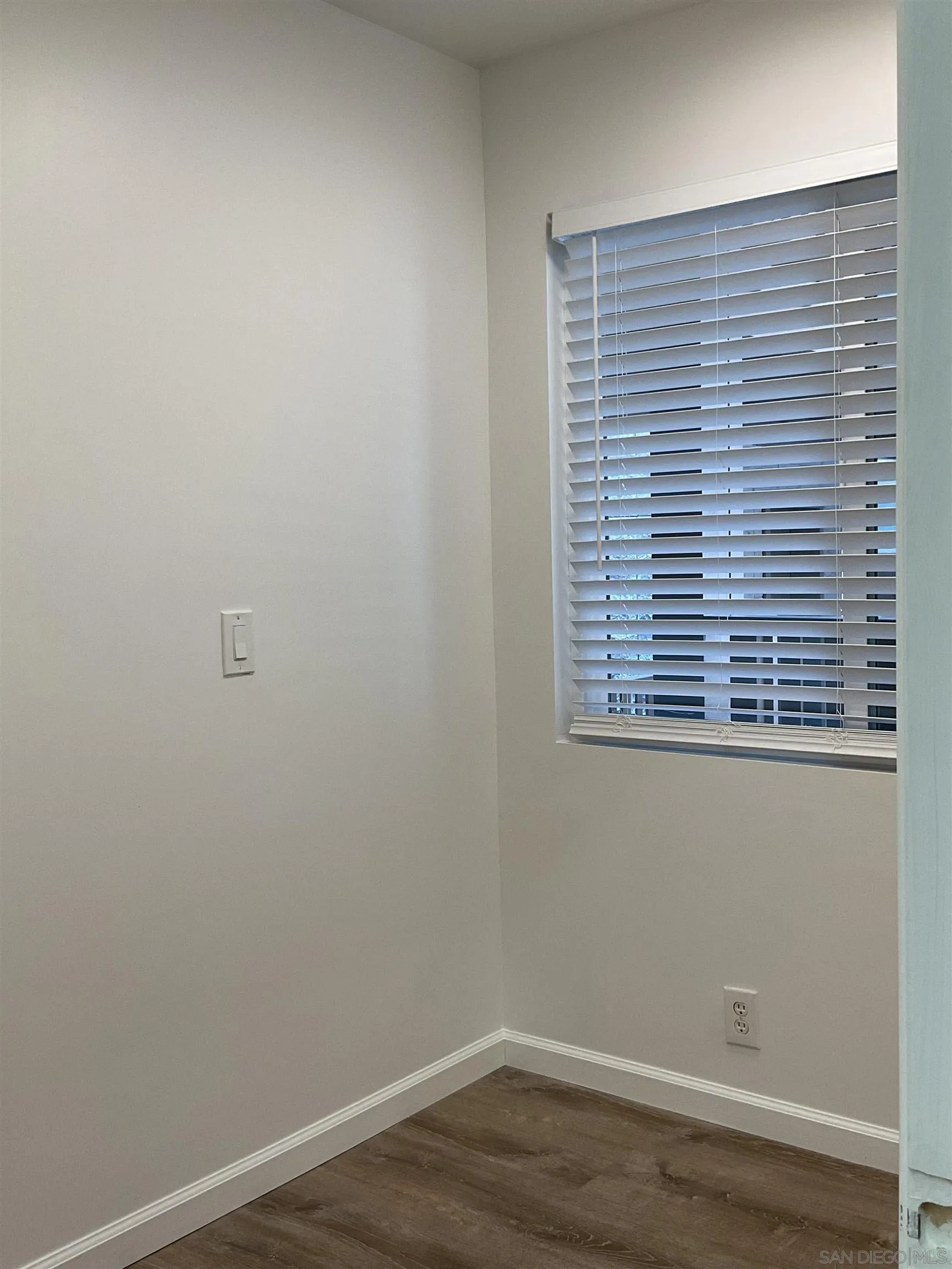 2600 Torrey Pines Road, Unit A25 La Jolla, CA 92037 - Photo 28 of 47 a view of a small space with wooden floor and a window
