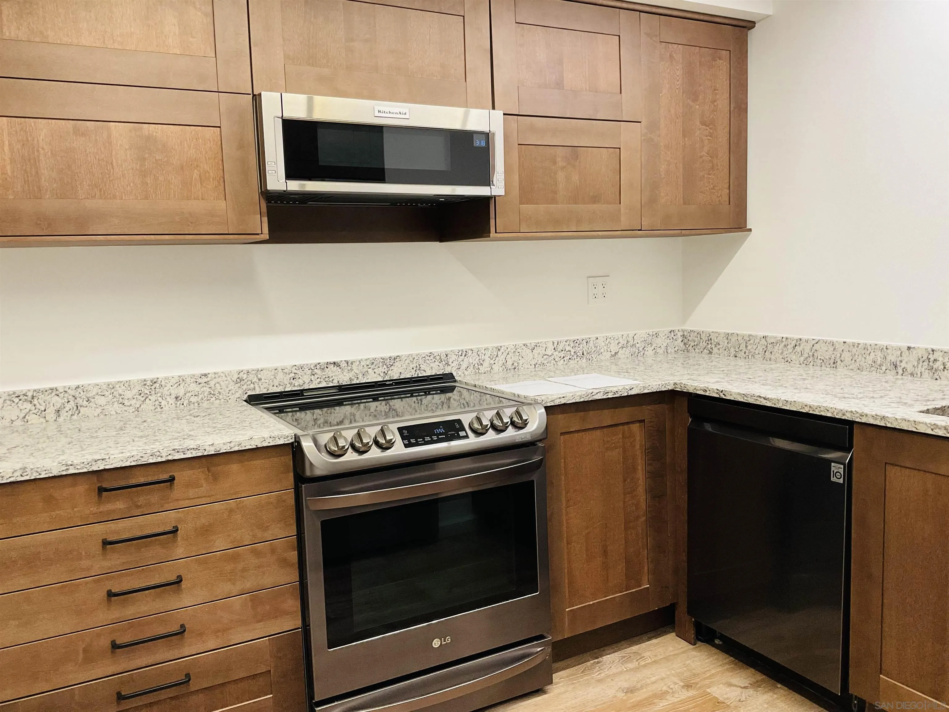 2600 Torrey Pines Road, Unit A25 La Jolla, CA 92037 - Photo 3 of 47 a kitchen with stainless steel appliances granite countertop cabinets and stove top oven