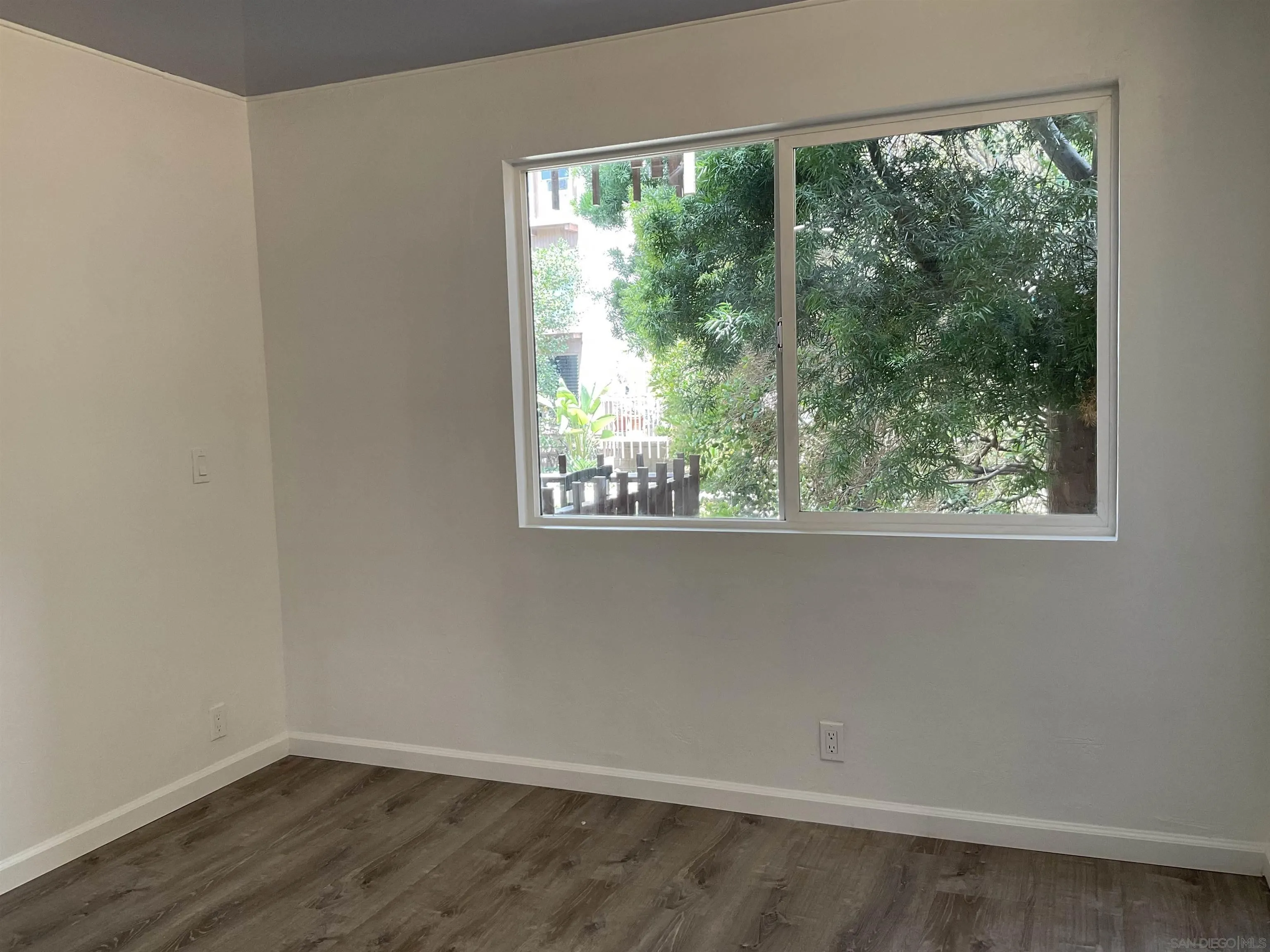 2600 Torrey Pines Road, Unit A25 La Jolla, CA 92037 - Photo 38 of 47 wooden floor in an empty room with a window