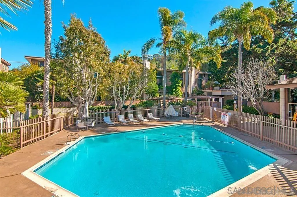 2600 Torrey Pines Road, Unit A25 La Jolla, CA 92037 - Photo 43 of 47 a view of a swimming pool with a patio and a yard