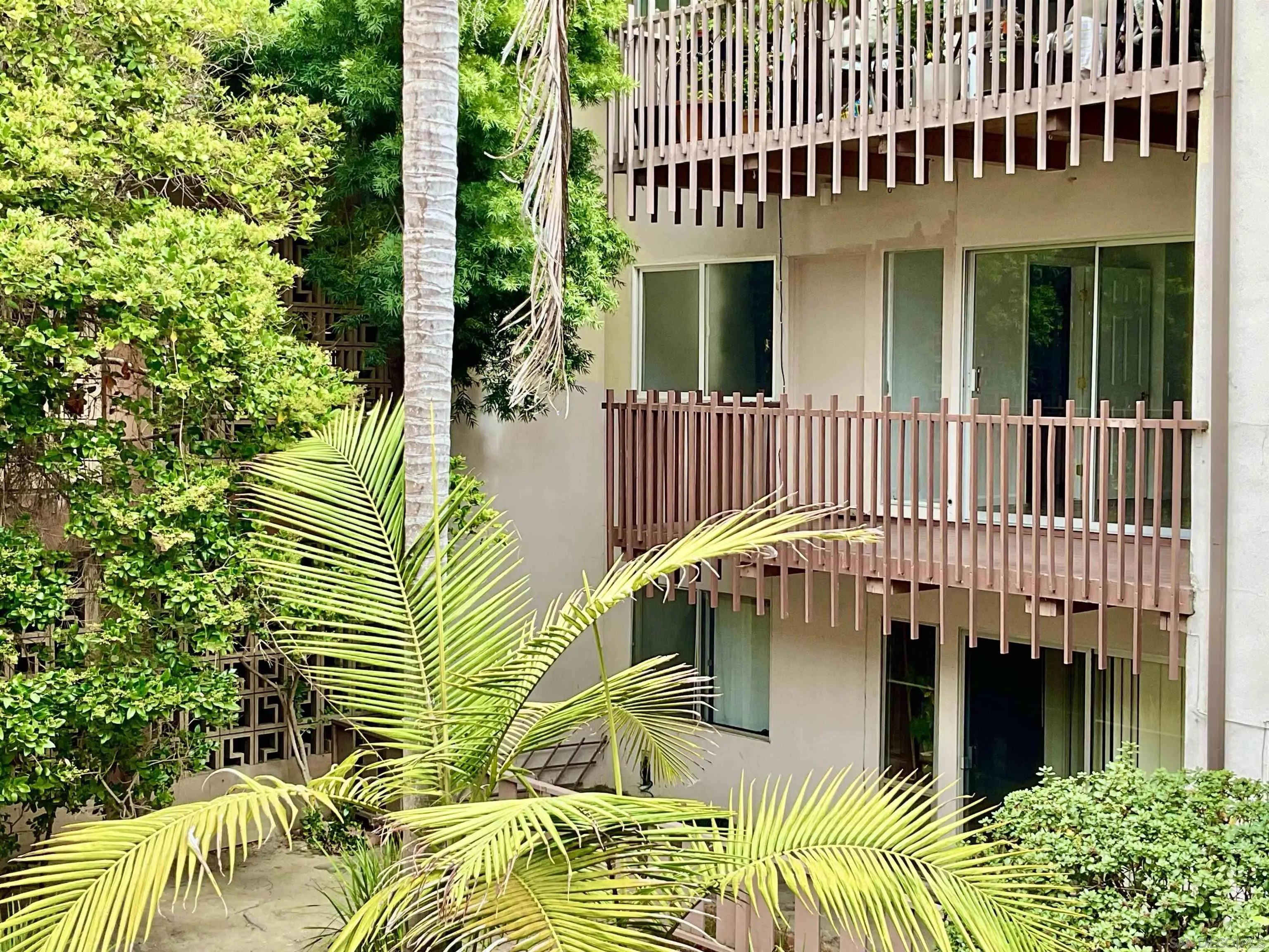 2600 Torrey Pines Road, Unit A25 La Jolla, CA 92037 - Photo 47 of 47 a view of a house with a patio and a garden