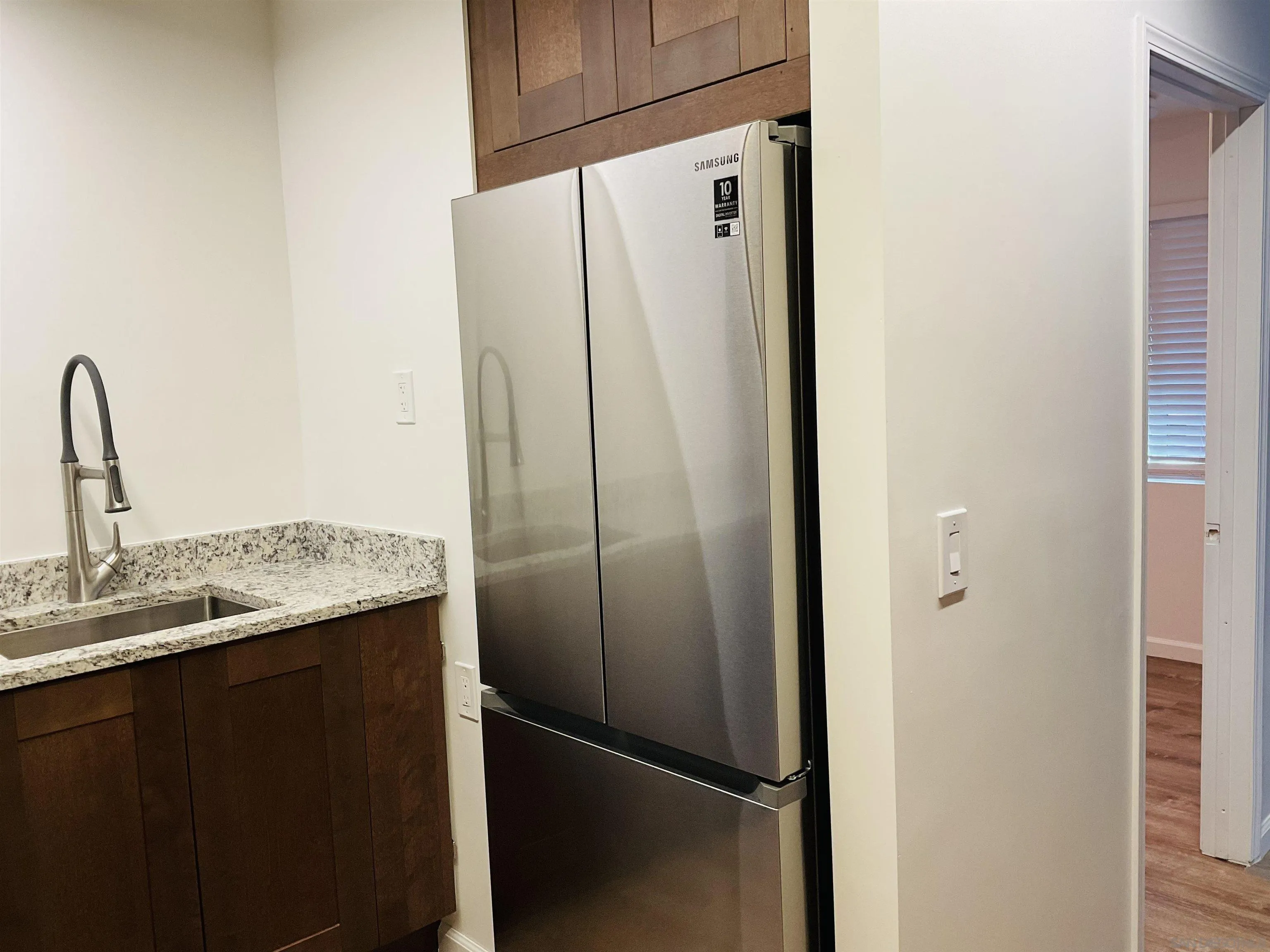 2600 Torrey Pines Road, Unit A25 La Jolla, CA 92037 - Photo 8 of 47 a bathroom with a granite countertop shower and a sink