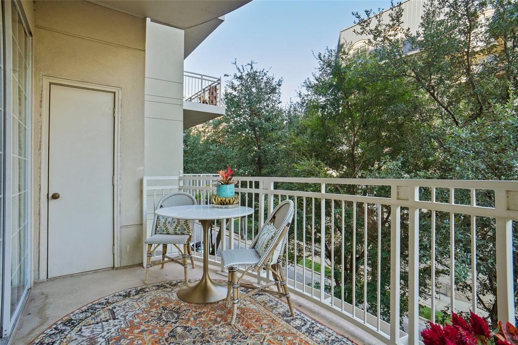 3225 Turtle Creek Boulevard, Unit 342 Dallas, TX 75219 - Photo 16 of 16 a roof deck with table and chairs and potted plants
