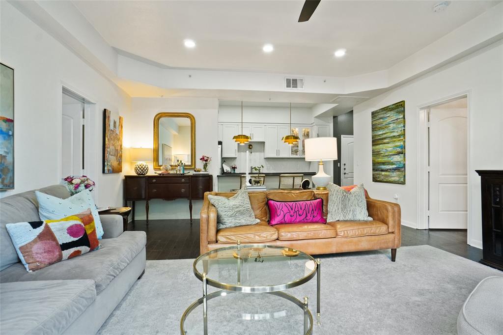 3225 Turtle Creek Boulevard, Unit 342 Dallas, TX 75219 - Photo 3 of 16 a living room with furniture and a large window