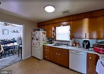 a kitchen with a sink cabinets and window