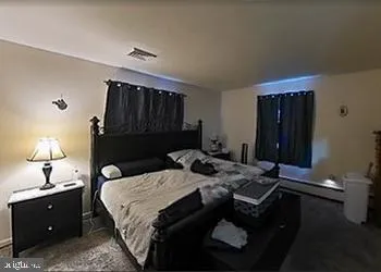 a bed room with a bed and a night stand