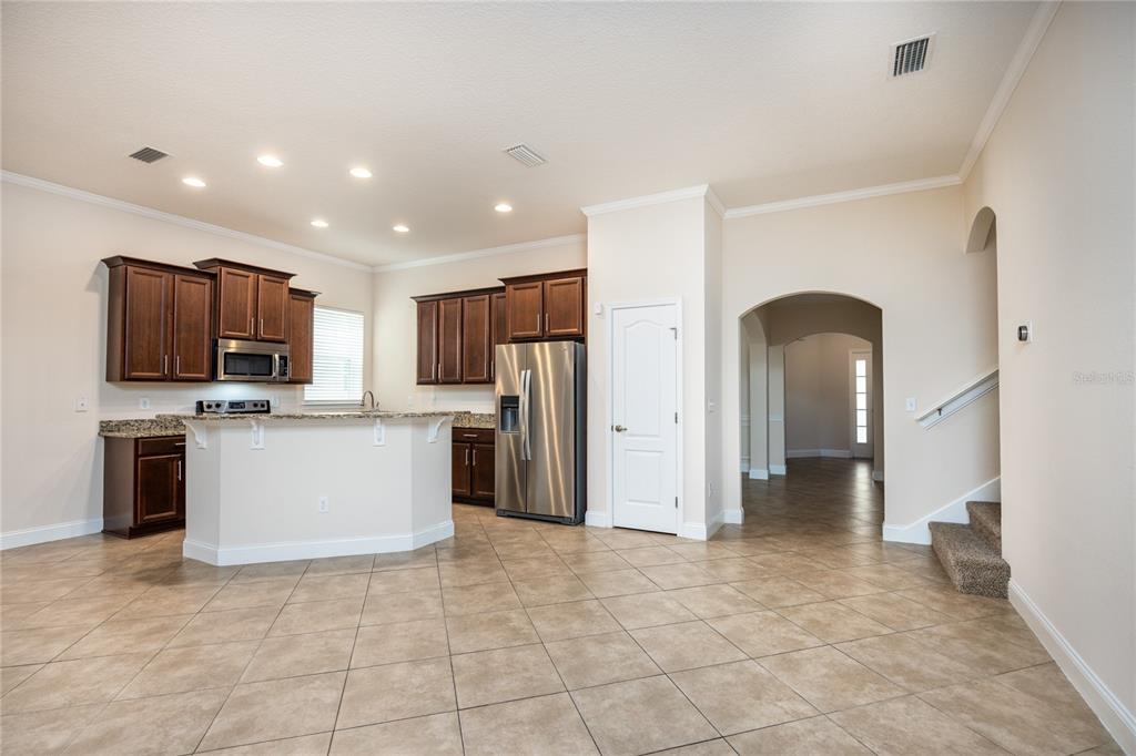 8216 Northwest 54th Street Gainesville, FL 32653 - Photo 26 of 58 a view of a kitchen with refrigerator stove microwave and cabinets