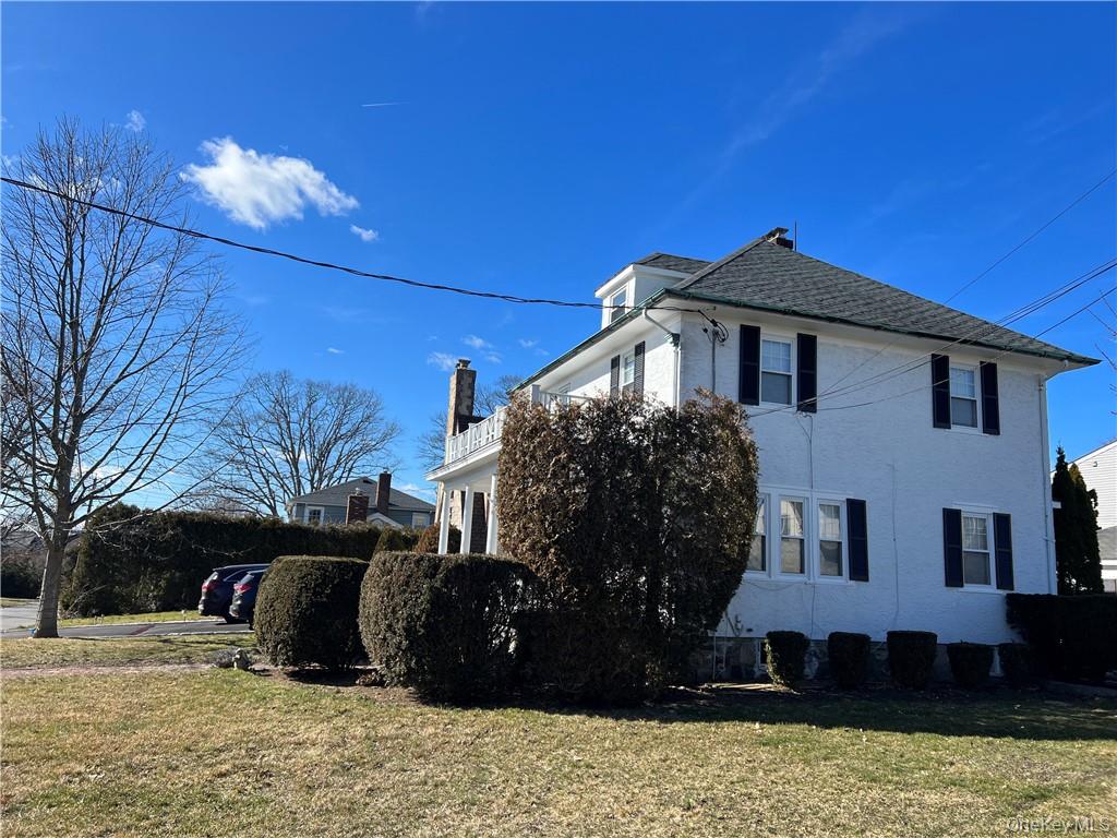 85 Locust Avenue Scarsdale, NY 10583 - Photo 12 of 38 a view of a house with a yard