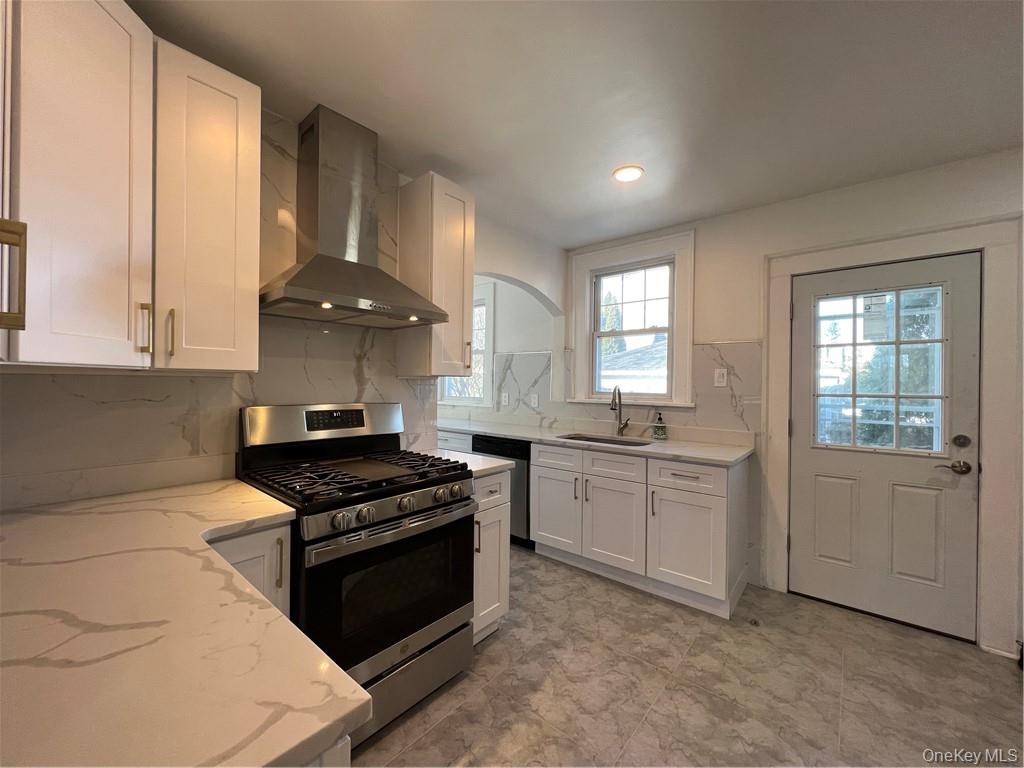 85 Locust Avenue Scarsdale, NY 10583 - Photo 16 of 38 a kitchen with granite countertop white cabinets and appliances