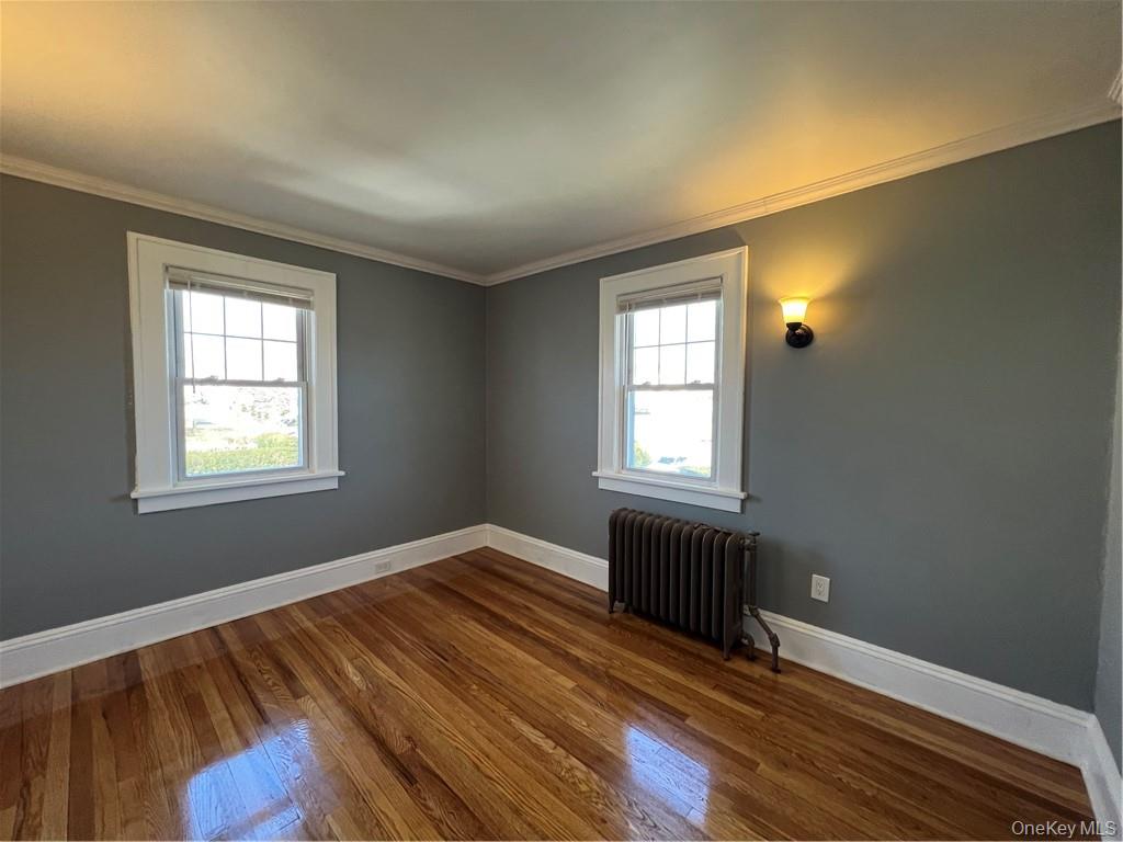 85 Locust Avenue Scarsdale, NY 10583 - Photo 32 of 38 a view of an empty room with wooden floor and a window