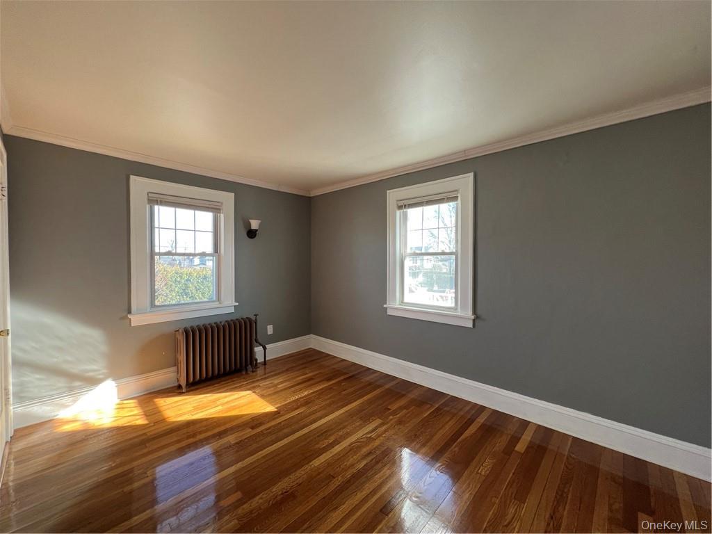 85 Locust Avenue Scarsdale, NY 10583 - Photo 33 of 38 a view of an empty room with wooden floor and a window