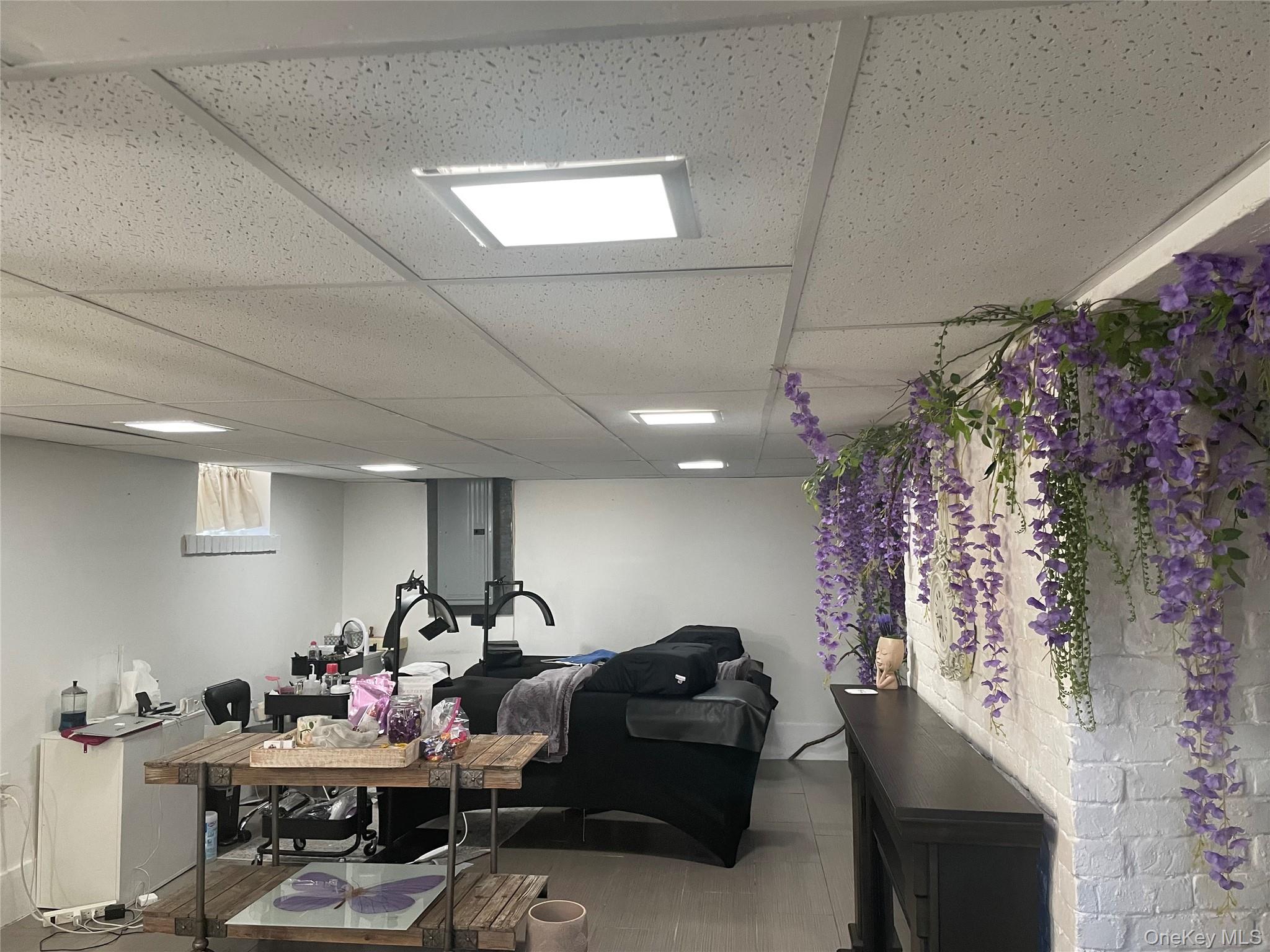 85 Locust Avenue Scarsdale, NY 10583 - Photo 34 of 38 a living room with furniture and a chandelier