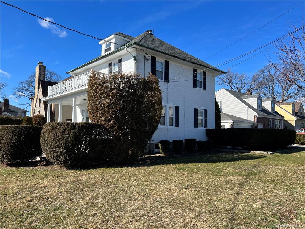 85 Locust Avenue Scarsdale, NY 10583 - Photo 4 of 38 a front view of a house with a yard