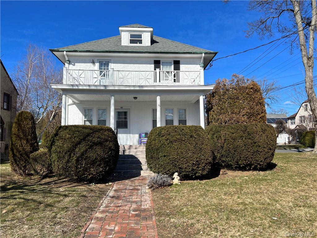85 Locust Avenue Scarsdale, NY 10583 - Photo 5 of 38 a front view of a house with a yard