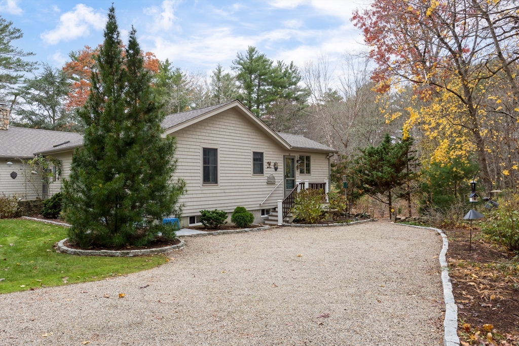 15 Parlowtown Road, Unit A Marion, MA 02738 - Photo 1 of 16 a view of a house with a yard and plants